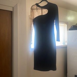 black midi dress with long sleeves with stones on one sleeve tan